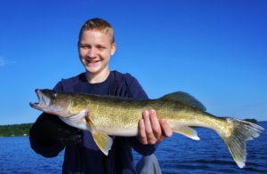 Young man with a great Brainerd Lakes Area walleye.