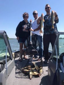 Group of happy fishermen with a limit of Walleyes!